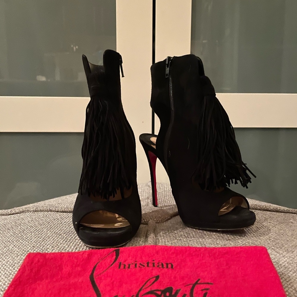 Christian Louboutin — black suede heels with fringe